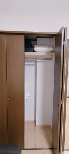 a cupboard with a plate on top of it at Sea Bloom Hotel in Dejimamachi