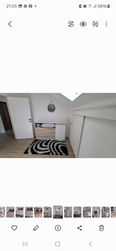 a view of a room with a table and a rug at L&L Apartman in Smederevska Palanka