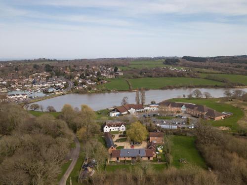 an aerial view of a town next to a river at Oak Barn - Fernhill Farm in Wootton Bridge