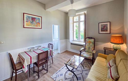 a living room with a table and a couch at Holiday Home Chenille-Change I-919 in Chenillé-Changé