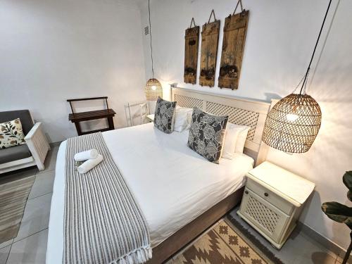 Ένα ή περισσότερα κρεβάτια σε δωμάτιο στο Leopard Tree Lodge