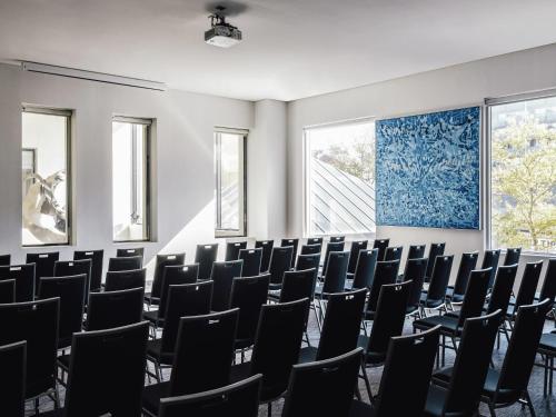 a room with rows of chairs in a classroom at The Como Melbourne in Melbourne
