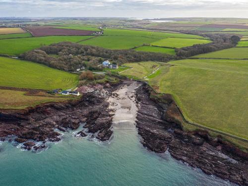 an aerial view of a beach and the ocean at Cranford-Cottage in Saint Brides