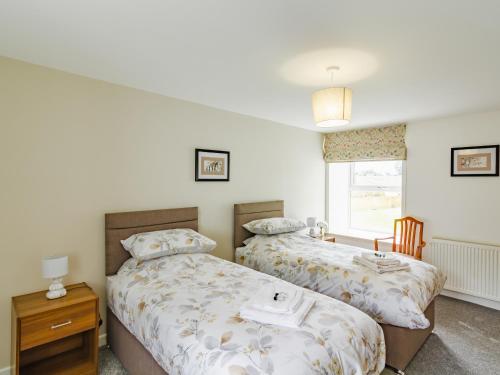 two beds sitting next to each other in a bedroom at Easter Caiplich - Uk30263 in Cray