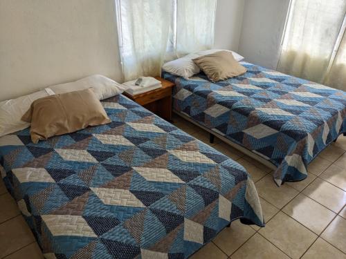 Ένα ή περισσότερα κρεβάτια σε δωμάτιο στο Katún boutique hotel