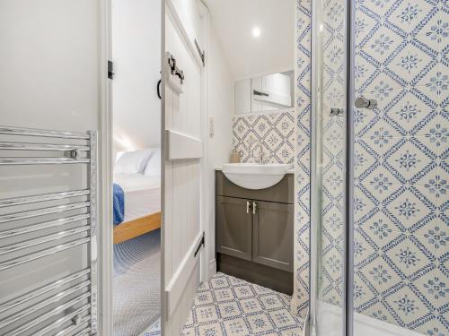 a small bathroom with a sink and a mirror at Orchard Barns - Uk47200 in Stapleton