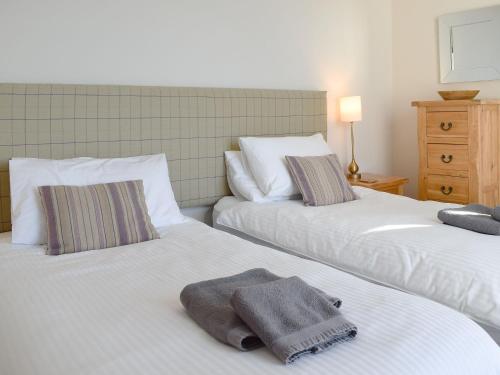 Ένα ή περισσότερα κρεβάτια σε δωμάτιο στο Harbourside Apartment