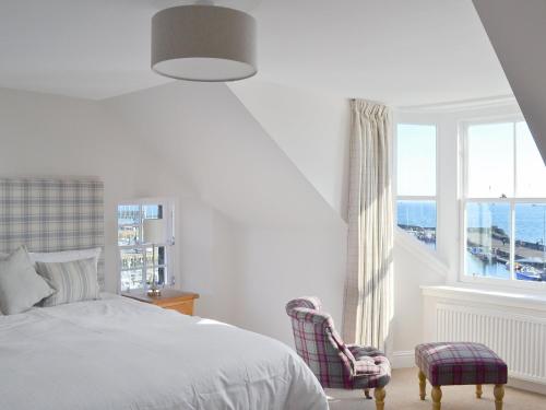 Ένα ή περισσότερα κρεβάτια σε δωμάτιο στο Harbourside Apartment