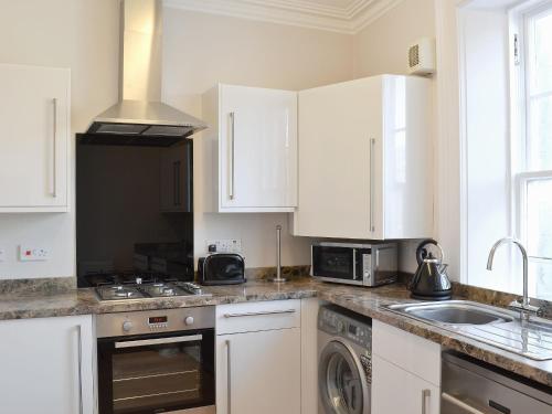 Η κουζίνα ή μικρή κουζίνα στο Harbourside Apartment