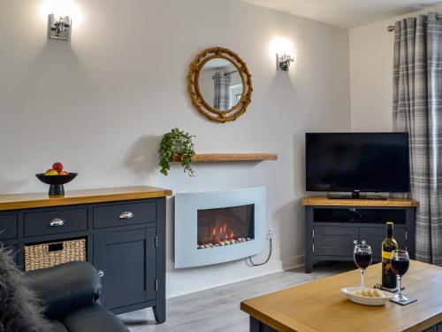 TV a/nebo společenská místnost v ubytování Anchor Cottage