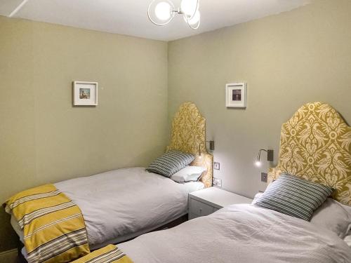 a room with two beds in a room at Alt Na Blathaich in Coirantee