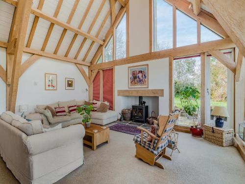 a living room filled with furniture and a fireplace at Wylye Croft in Upwey