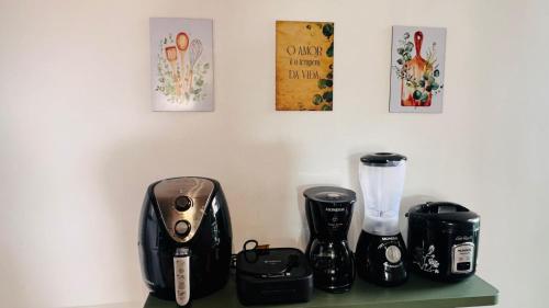 a counter with two coffeemakers on top of it at Hoa Beach Flat 205 in Tamandaré