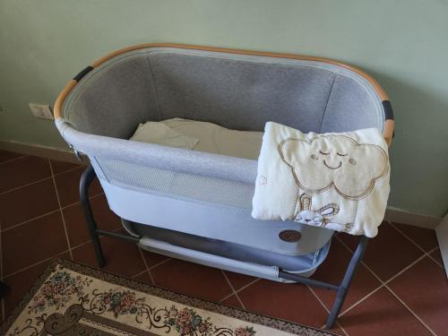 a blue crib with a pillow on top of it at Gioia Montedoro in Viareggio