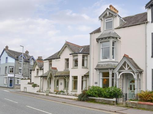 a row of white houses on a street at Linton in Keswick