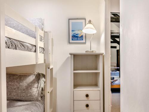 a bedroom with a bunk bed and a closet at North Lake Chapel in West Worlington