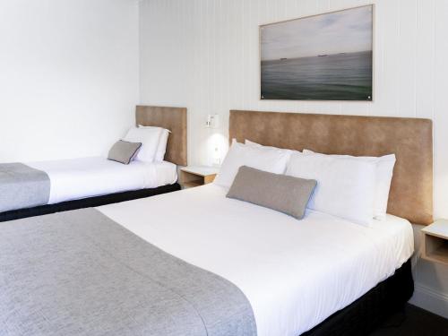 Postel nebo postele na pokoji v ubytování Mercure Charlestown