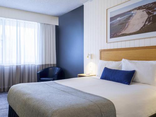 Postel nebo postele na pokoji v ubytování Mercure Charlestown