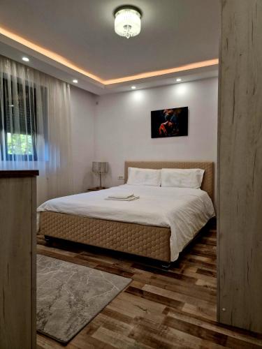 Ένα ή περισσότερα κρεβάτια σε δωμάτιο στο Cosy Vibe 2
