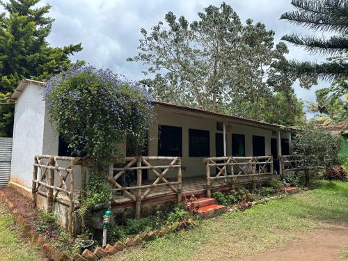 a house with a fence in front of it at The Big Cat's Den - Maravakandy Resort, Masinagudi in Masinagudi