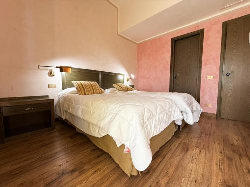 Postel nebo postele na pokoji v ubytování Astor Hotel Vintage