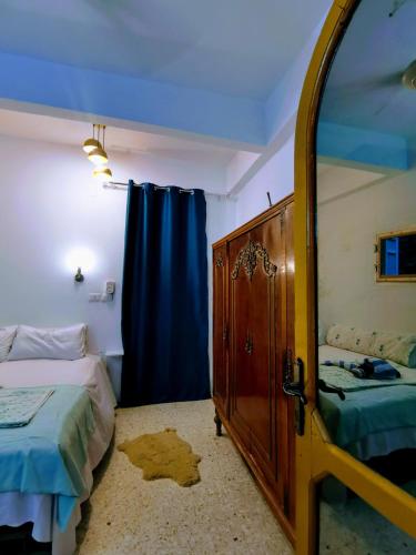 Katil atau katil-katil dalam bilik di HabuHeritageHomeStayInLuxor
