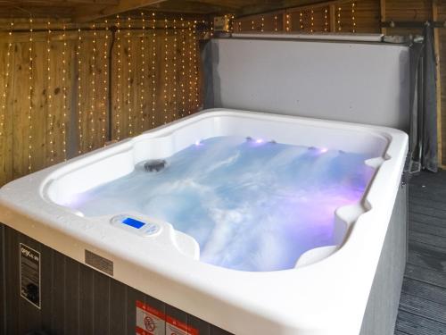 a jacuzzi tub with lights in a room at Vallum Villa - Uk40231 in Bardon Mill