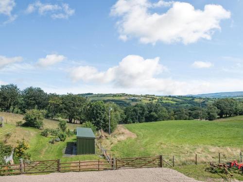 a view from the top of a hill with a fence at Penceunant in Penuwch