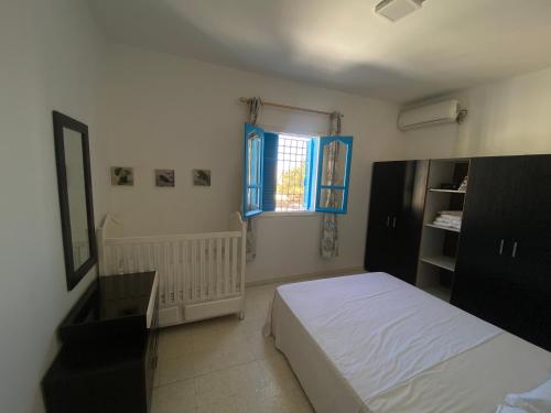 Voodi või voodid majutusasutuse Dar El Jasmin - Étage de Villa à Djerba Houmt Souk toas