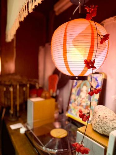 a lamp on top of a table in a room at KOBE coffee hostel in Kobe