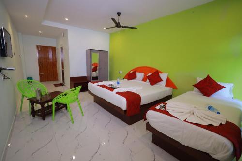 Hotel Rajeswari Internationalにあるベッド