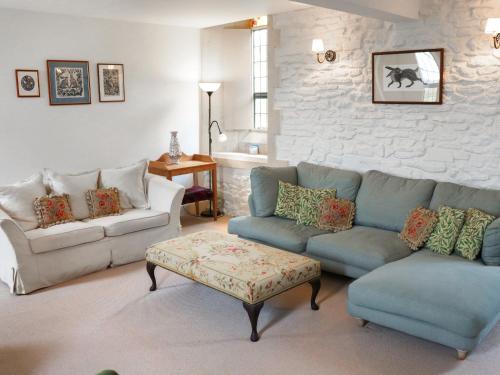 a living room with two couches and a coffee table at St Peters in Highway