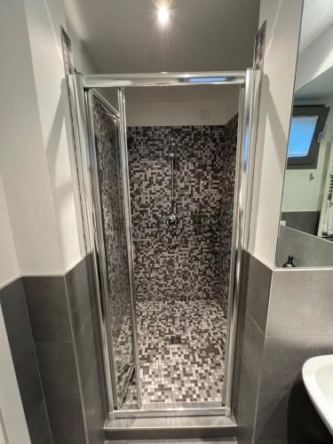 a shower with a glass door in a bathroom at LoftDesign in Verona