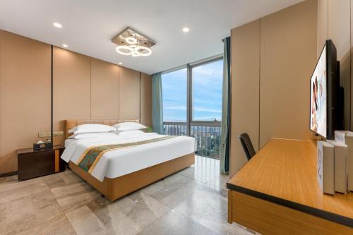 Postel nebo postele na pokoji v ubytování JunHome International Apartment-Beijing Rd A-mall