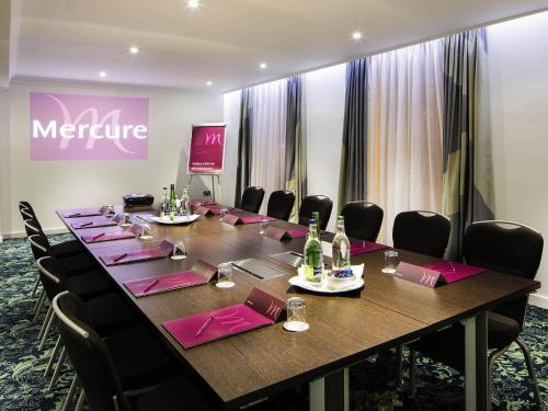 a large conference room with a long table and chairs at Mercure Darlington King's Hotel in Darlington