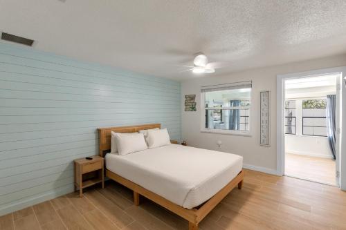 a bedroom with a bed and a window at Beach Getaway on Anna Maria Island in Holmes Beach