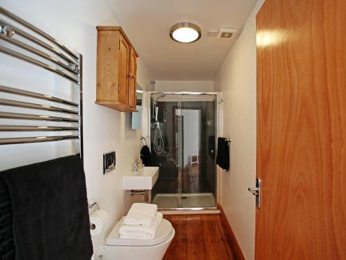 a bathroom with a shower and a toilet and a sink at Dreamers View in Margate