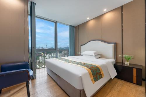 Postel nebo postele na pokoji v ubytování JunHome International Apartment-Beijing Rd A-mall