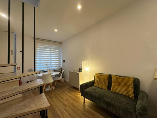 a living room with a couch and a table at Il nido della rondine in Ostra