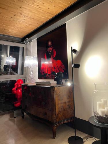 a room with a painting of a woman on the wall at LoftDesign in Verona