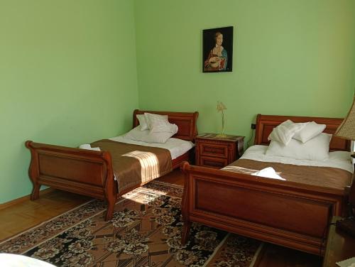 Postel nebo postele na pokoji v ubytování Hotel Jagielloński