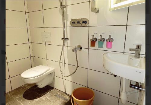 a bathroom with a toilet and a sink at Gorgeous villa near Eden beach in Puducherry