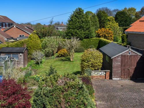 an aerial view of a garden with trees and bushes at Ballyholme in Skelton