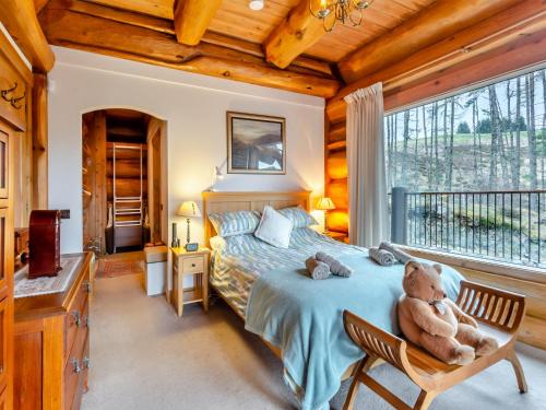 Ένα ή περισσότερα κρεβάτια σε δωμάτιο στο Molalatau Lodge