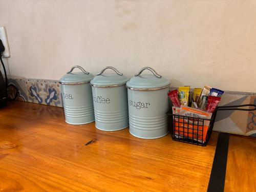 four trash cans sitting next to a basket of snacks at 59 van Heerden in Mokopane