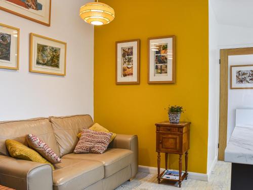 a living room with a couch and a table at Secret Spot in Newton