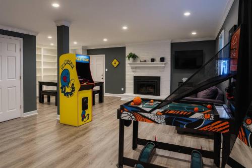 a living room with a video game system and a game console at Modern Stay on Green Valley - 2.5 Mi to Downtown in Sunset Hills