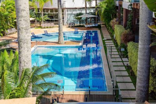 Piscina de la sau aproape de Boulevard Bombinhas - Apartamento em Condo com Piscina