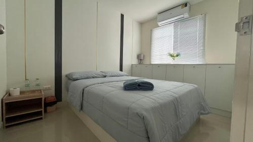Ένα ή περισσότερα κρεβάτια σε δωμάτιο στο RADIANT Smile HOTEL