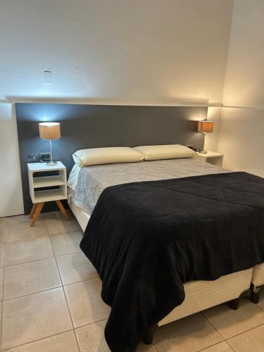 En eller flere senge i et værelse på Casa Pueblo